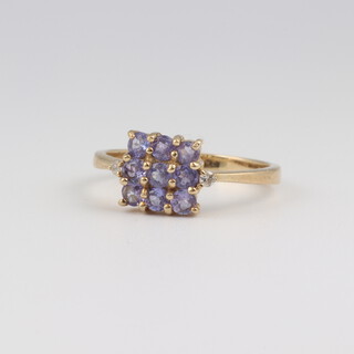 A 9ct yellow gold square amethyst set cluster ring, size N, 2.3 grams 
