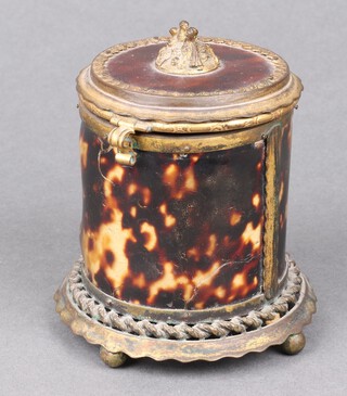 A 19th Century square cut glass bottle with gilt decoration (chip to lid) contained in a cylindrical gilt metal and tortoiseshell case 10cm x 9cm 