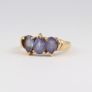 An 18ct yellow gold ring set 3 heart shaped amethysts, size N, 4.5 grams 