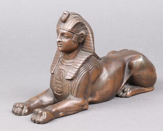 A 1920's cast metal figure of a sphinx 14cm x 24cm 