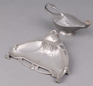 A WMF Art Nouveau shaped inkwell 19cm (glass liner missing), a Kayserzin pewter table lighter in the form of an oil lamp 8cm and a reprint of a 1907 catalogue 