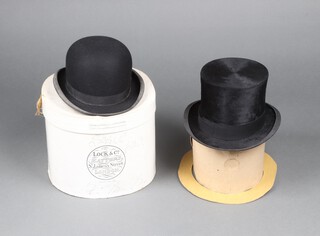 Lock & Co, a gentleman's bowler hat size 7 1/8, complete with box, together with a G A Dunn & Co. black top hat size 7