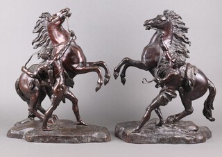 After Guillaume Coustou (1677-1746), a 19th century pair of patinated bronze "Marly" horses with attendant figures in loincloths (one with quiver), unsigned,  each 50cm h x 40cm w