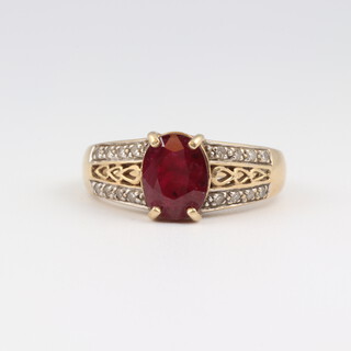 A 9ct yellow gold ring set an oval colour enhanced and treated gem stone, size M 1/2, 4.1 grams