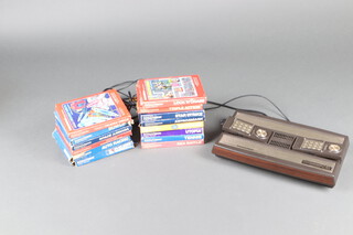 A 1970's Intelevision Games Console by Mattel Electronics complete with power supply, 2 joy pads and 14 games - Star Strike, Astrosmash, Math Fun, Utopia, Tennis, Sea Battle, Space Armada, Advanced Dungeons and Dragons, Auto Racing, Major League Baseball, Bowling, Deadly Discs, Triple Action and Lock "n" Chase  (all boxed) 