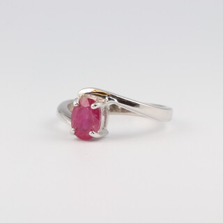 A 9ct white gold ring set an oval cut treated "ruby", size N, 2.8 grams 