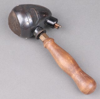 A hand held microphone marked Microphone RET PA10177 with wooden handle 