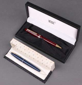 A Mont Blanc fountain pen contained in a red and gilt case together with a Parker fountain pen in a blue case 