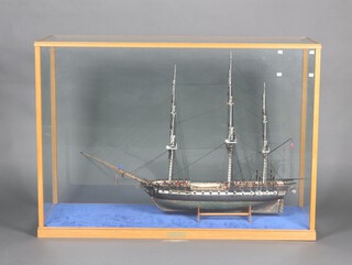 A wooden scratch built model of a 3 masted American war ship "The USS Constitution", contained within an oak framed and glass case 80cm h x 114cm w x 40cm d 