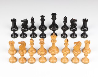 Attributed to Jaques & Son Ltd London -  a Staunton ebony and boxwood 32 piece chess set. A rook and knight of each colour with red crown stamp to surface, (chip to both black bishop's mitres, minor chip to castellation on both rooks, the black kings cross from his crown is damaged, chips to the white queen's crown) 