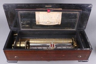 A J M & Co 19th Century Swiss music box with 33cm cylinder, playing 8 aires, the lid with original paper label, contained in an inlaid rosewood case, 16cm x 62cm w x 24cm d 