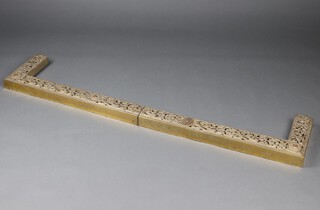 A Continental pierced brass fire curb 5cm h x 152cm w x 29cm d, in 2 sections