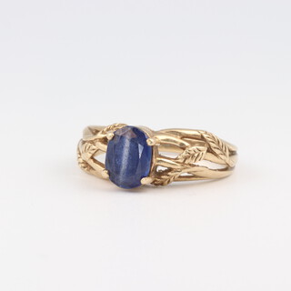 A 9ct yellow gold ring set an oval blue gem stone, size N, 3.7 grams