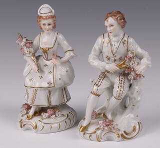 A pair of Sitzendorf porcelain figures of seated lady and gentleman, base with Sitzendorf mark and impressed 89 11cm 