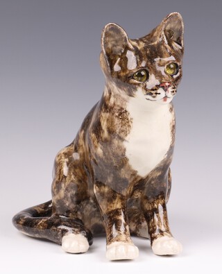 A Jenny Winstanley pottery figure of a seated cat, the base with signature and numbered 4, England 23cm