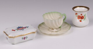 A Belleek miniature cup and saucer the base with black mark, a late Meissen vase of waisted form the base marked 22 and impressed P193 6cm h, together with a rectangular jar and cover 401 157 (cancellation mark to base) 10cm 