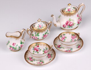A Royal Crown Staffordshire 5 piece floral patterned dolls tea service with teapot, lidded sugar bowl, milk jug and 2 cups and saucers 