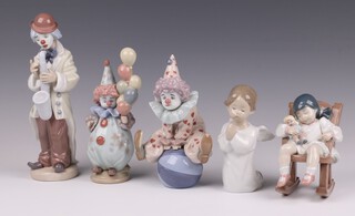 Five Lladro figures Sad Sax 5471  23cm, Having a Ball 5813 18cm, The Littlest Clown 5811 18cm, Nap Time 5448 and Angel Praying 4538 13cm  