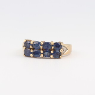 A 9ct yellow gold ring set 8 sapphires, size L, 3.6 grams 