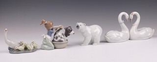 Four Lladro figures - Bashful Bather 5455 13cm, Endless Love 6585 13cm, Little Ducks after Mother 1307 10cm, Polar Bear Cub 10cm