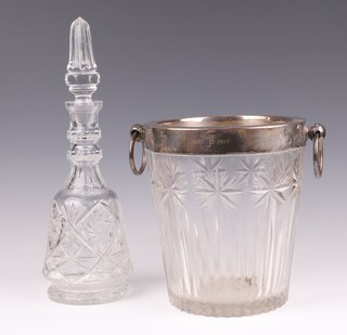 A cut glass wine cooler with silver plated mount and ring drop handles, inscribed J B 1975-2000, 23cm and a club shaped cut glass decanter and stopper 37cm 