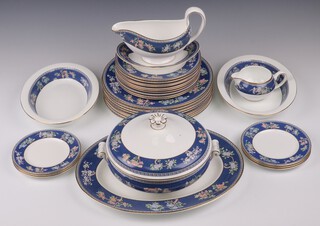 A Wedgwood 31 piece Blue Siam patter dinner service comprising oval meat plate, twin handled soup tureen and cover, 2 oval bowls, 8 dinner plates, 10 side plates, sauce boat and stand, 6 tea plates and cream jug  