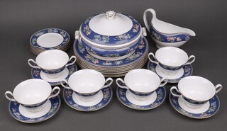 A 28 piece Wedgwood blue Siam pattern dinner service comprising twin handled tureen and cover, 8 dinner plates, sauce boat, 6 twin handled soup bowls and saucers and 6 tea plates 