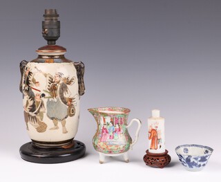 A Japanese Satsuma pottery vase decorated warriors converted to a table lamp 23cm, a Canton famille rose jug of waisted form raised on 3 feet 9cm (cracked), a Chinese blue and white octagonal tea bowl with panel decoration of figures 4cm (some chips to the rim), a miniature Rollo vase decorated courtly figures 8cm 