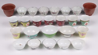 Two 20th Century Tan Ware saki cups, 6 floral patterned ditto and 17 others, on wooden bases 