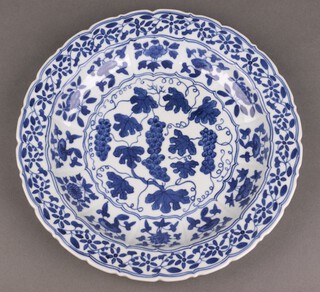 A Chinese early 20th Century blue and white shallow bowl with leaf and floral decoration 27cm w 