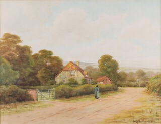 George Oyston (British, 1861-1937), Figure on a Country Road, watercolour, signed and dated 1925, 26cm x 34cm, within a stained gilt frame.