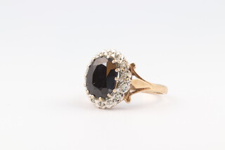 A 9ct yellow gold sapphire and diamond ring, size L, 2.6 grams  