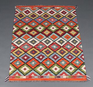 A green, white and orange ground Chobi Kilim rug with all over diamond design 150cm x 102cm 