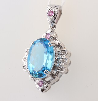 A 9ct white gold pendant set a "topaz" coloured stone, 11.3 grams 