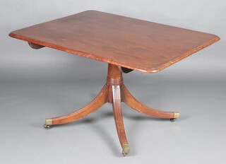 A Georgian mahogany rectangular snap top breakfast table raised on reeded tripod supports, brass caps and casters 70cm h x 121cm w x 96cm d 