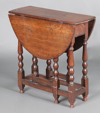 A 19th Century, 17th Century style, oak oval drop flap gateleg tea table, raised on turned supports 67cm h x 67cm w x 24cm 