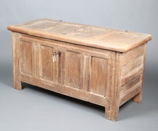 A 17th/18th Century Continental bleached oak coffer of panelled construction with hinged lid 62cm h x 119cm w x 52cm d 