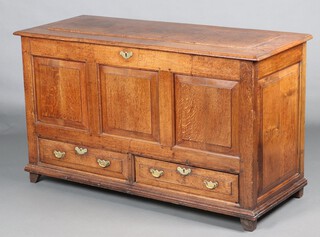An 18th Century oak mule chest of panelled construction, the base fitted 2 drawers with replacement drop handles, raised on bracket feet 83cm h x 143cm w x 59cm 