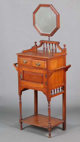 A Victorian walnut wash stand with octagonal bevelled plate mirror and towel rail to each side, the base fitted 2 short drawers above a cupboard enclosed by a panelled door, above a recess, raised on turned supports 157cm h x 49cm w x 34cm d 