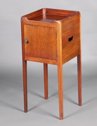 An Edwardian, Georgian style mahogany tray top commode fitted a cupboard enclosed by a panelled door, raised on square tapered supports 81cm h x 35cm w x 35cm d 