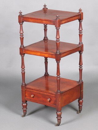 A Victorian square mahogany 3 tier what-not, the base fitted a drawer, raised on turned supports with brass caps and casters 97cm h x 42cm w x 37cm d.  