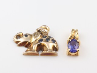 An 18ct gold and tanzanite pendant 2.1 grams and a 14ct gold pendant in the form of an elephant 2.8 grams 
