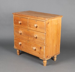 A 19th Century pine chest of 2 short and 2 long drawers with replacement turned handles, raised on bun feet 80cm h x 83cm w 45cm d 