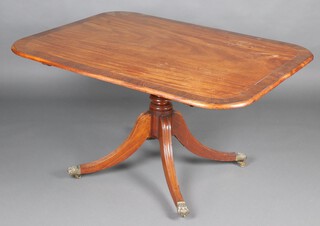 A 19th Century rectangular crossbanded mahogany breakfast table, raised on a ring turned column and tripod base with brass paw caps and casters 71cm h x 130cm w x 97cm d  