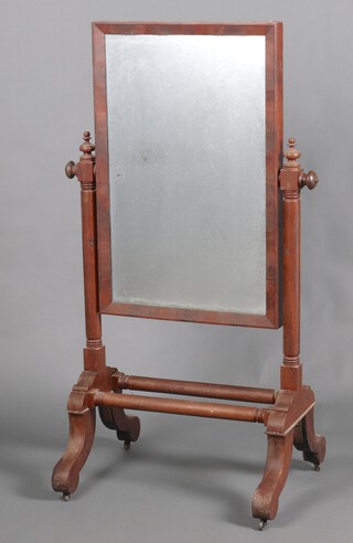 A Victorian rectangular plate cheval mirror within a mahogany frame, raised on a turned mahogany stand 140cm h x 68cm w x 56cm d 