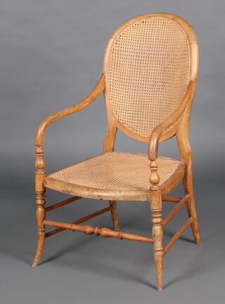 A 19th Century Continental beech open arm chair with woven cane seat and back, raised on turned supports with turned stretchers 92cm h x 54cm w x 49cm d 