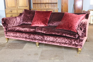 A Duresta knowle style drop end 3 seater settee, upholstered in burgundy velour, raised on square supports with brass caps and casters 80cm h x 224cm w x 104cm d 