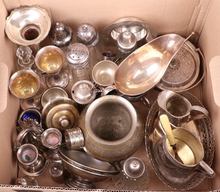 An oval pierced silver plated dish, 2 silver plated milk jugs and 5 glass sugar casters with plated mounts 