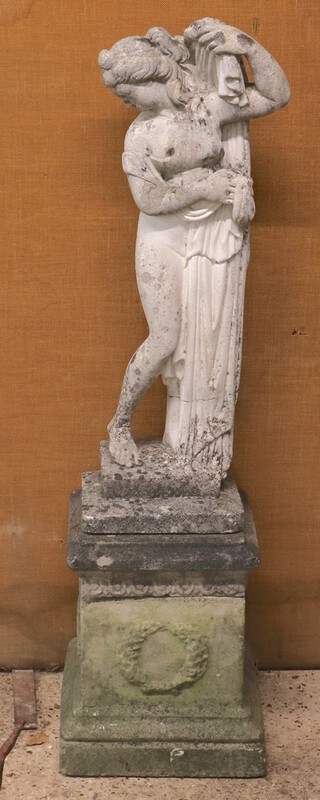 A well weathered concrete garden  statue of a classical lady on a square base 118cm h (in 3 sections) 