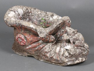 A well weathered concrete garden  planter in the form of a boot 21cm 